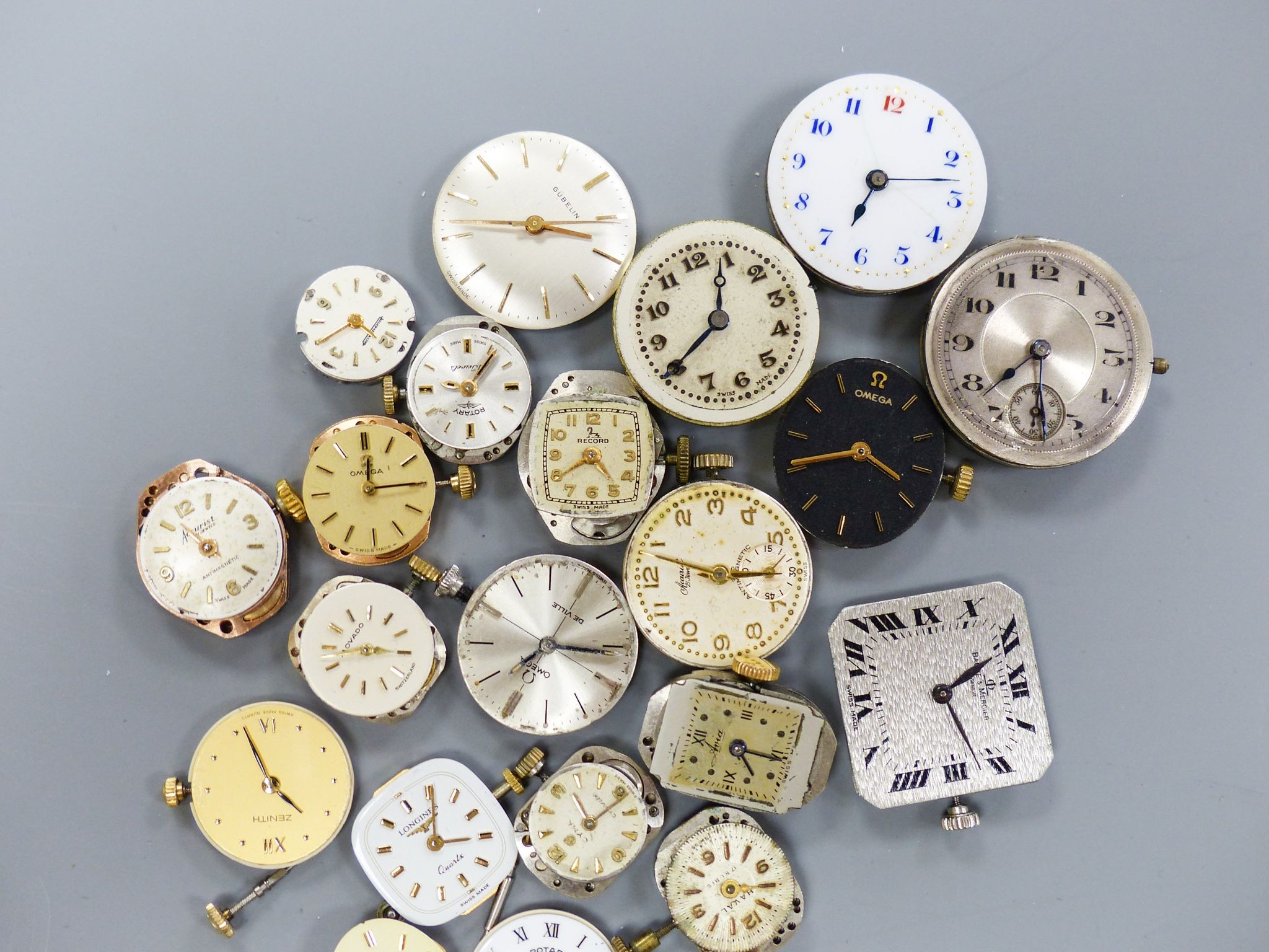 A small quantity of wrist watch movements including Baume & Mercier, Omega and Rotary.